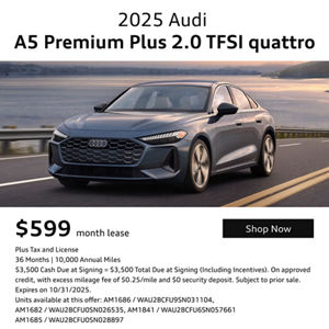 2025 Audi A5 Premium Plus 2.0 TFSI quattro driving down a road